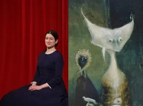 Woman sitting next to artwork